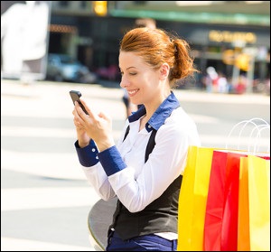 Woman Texting on City Street